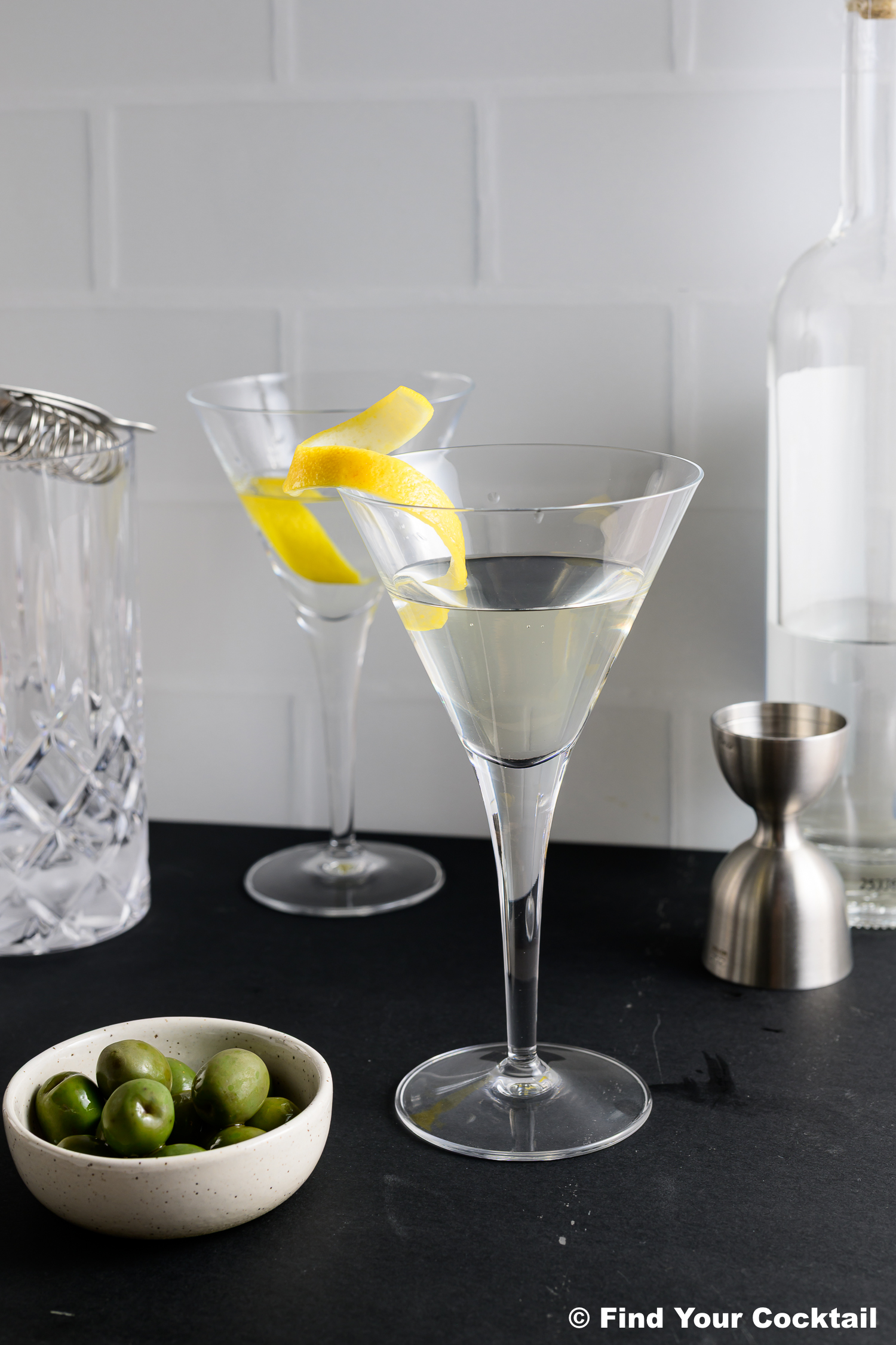 2 vodka martinis with lemon twists