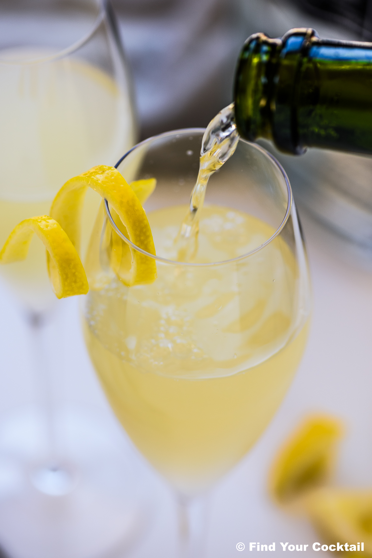 pouring sparkling wine into a flute glass. 