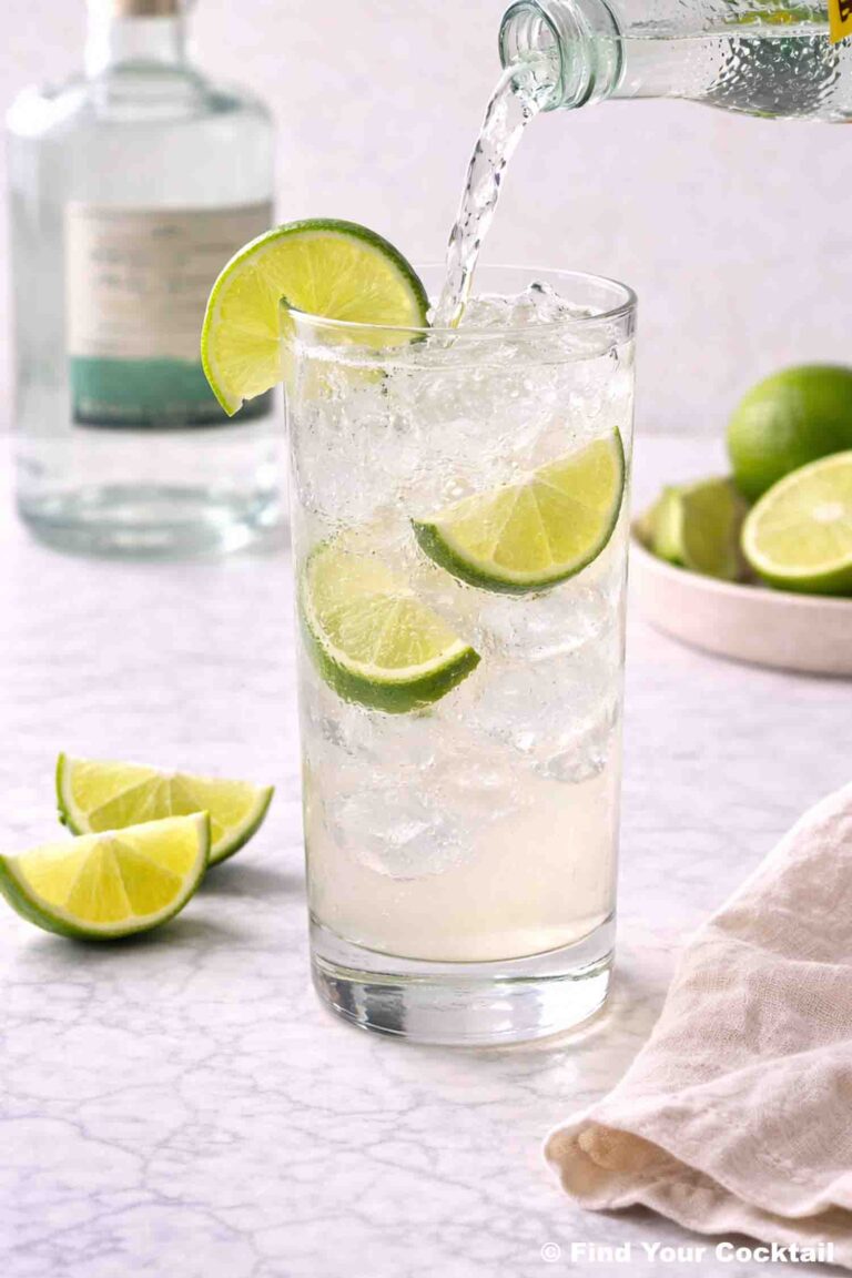 Topo Chico being poured into a tall glass of ranch water.