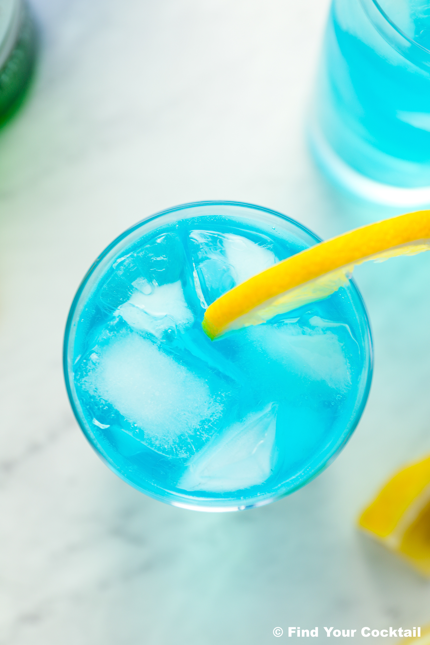 looking down on an ocean blue long island blue iced tea in a tall glass