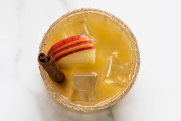 Recipe instruction photo: an apple bourbon smash in a glass